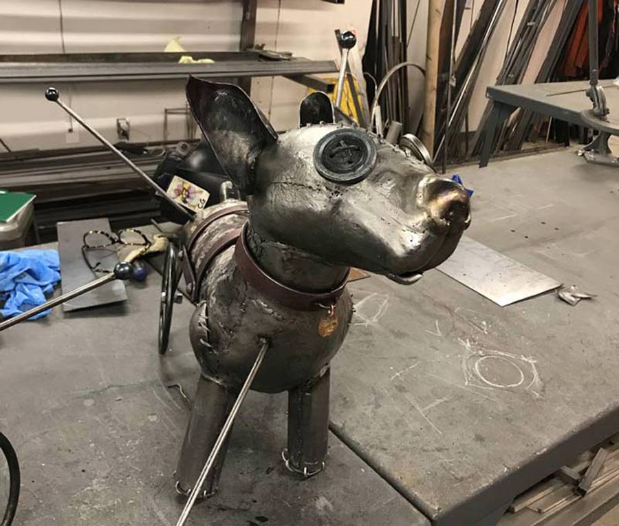 NYC metal artist De Nadie dog metal sculpture