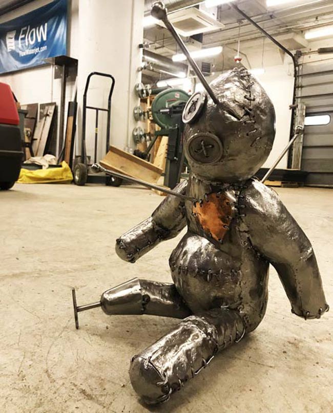 voodoo doll handicap metal scupture 